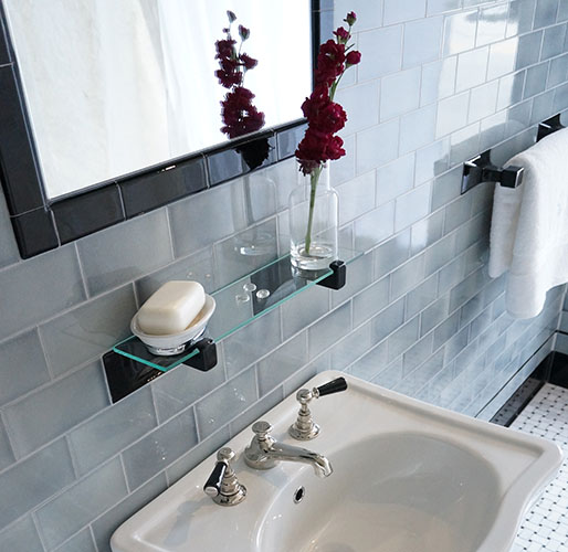 blue subway tile in bathroom