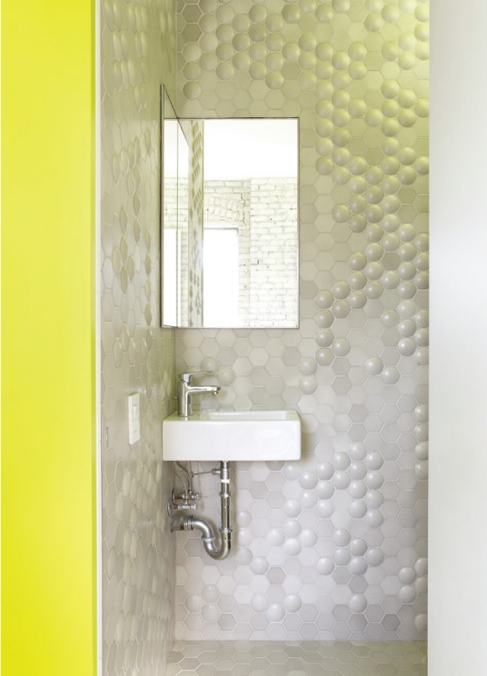 white flat and domed hex field tile in white on bathroom wall with white hex tile on floor in bathroom